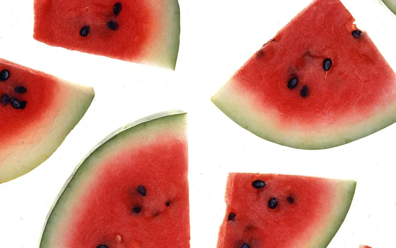 Wedges of red-fleshed watermelon with black seeds